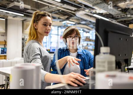 Professional female employees working in a printing house Stock Photo