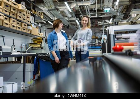 Professional female employees working in a printing house Stock Photo