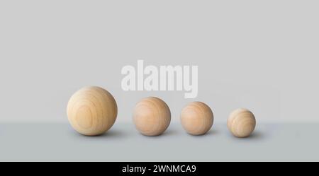 Four wooden balls in a row background Stock Photo