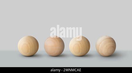 Four wooden balls in a row background Stock Photo