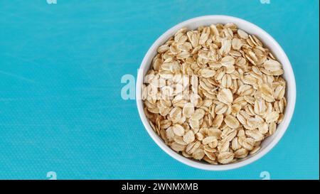Picture of organic oat flakes in a bowl, selective focus. Stock Photo