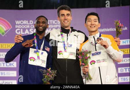 USA's Shelby McEwen, silver, New Zealand's Hamish Kerr, gold, and Korea's Sanghyeok Woo, bronze, (left-right) on the podium for the Men's High Jump during day three of the World Indoor Athletics Championships at the Emirates Arena, Glasgow. Picture date: Sunday March 3, 2024. Stock Photo