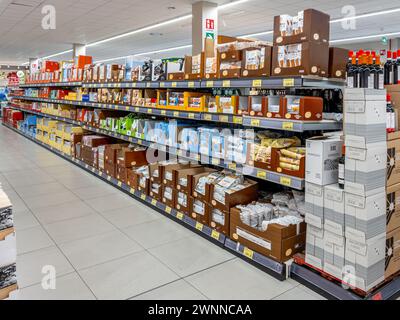 Sommariva del Bosco, Italy - March 02, 2024: Aisle with shelves with packages of cookies and snacks in discount store INS of PAN Group Stock Photo