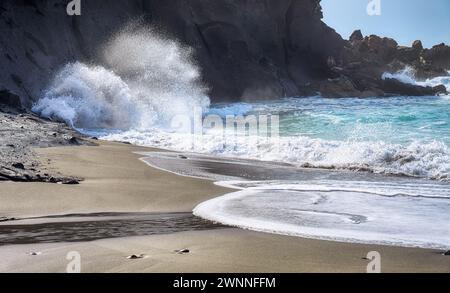 Sandy beach of Playa de la Pared with cliffs and the atlantic ocean with surging billows on the west coast of Fuerteventura, Canary Islands, Spain Stock Photo
