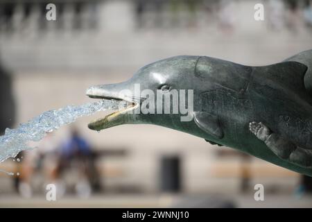 Detail of the Jellicoe Memorial Fountain, located on the west side of Trafalgar Square, features a mermaid with two merchildren and dolphins. It was d Stock Photo