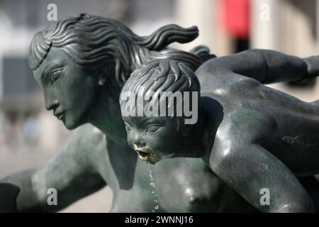 Detail of the Jellicoe Memorial Fountain, located on the west side of Trafalgar Square, features a mermaid with two merchildren and dolphins. It was d Stock Photo