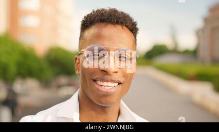 African man looks at camera and smiles Stock Photo