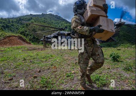 Mina Zorra, Panama. 29 February, 2024. U.S. Army soldiers unload food and structural materials from a UH-60 Blackhawk helicopter during Exercise PANAMAX, February 29, 2024 near Mina Zorra, Panama, Feb. 29, 2024. During the exercise the 1-228th Aviation Regiment transported over 500 thousand pounds of equipment including food and supplies as well as medical team to care for local residents.  Credit: TSgt. Nick Erwin/US Army/Alamy Live News Stock Photo