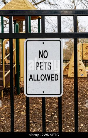 No pets allowed sign at the entrance to a children's playground in a residential neighborhood in Pike Road Alabama, USA. Stock Photo