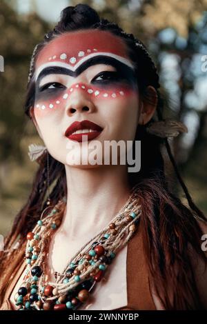 Outdoor close-up portrait of the cute young shamaness (witch doctor) Stock Photo