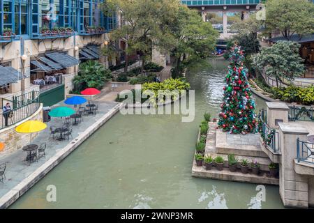 Decorated Christmas tree on a platform at the River Center shopping mall on the River Walk in downtown San Antonio, Texas Stock Photo