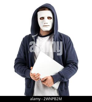 Hacker in mask with laptop on white background Stock Photo
