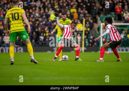 Romaine Mundle of Sunderland is put under pressure from Jack Stacey of ...