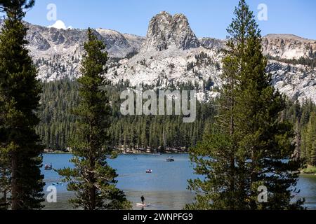 Crystal Crag, an imposing and rugged slab of granite, looms large over the lakes in Mammoth Lakes, CA. Stock Photo