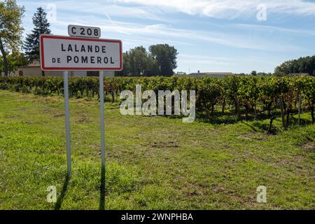 City road sign Lalande de Pomerol near Saint-Emilion wine making region, growing of Merlot or Cabernet Sauvignon red wine grapes, France, Bordeaux in Stock Photo