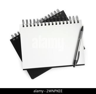 Two notebooks and pen isolated on white, top view Stock Photo