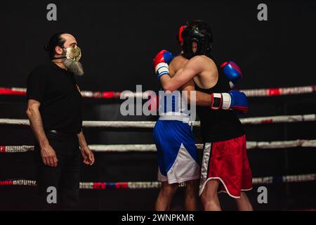 Boxers hugging after fight Stock Photo - Alamy