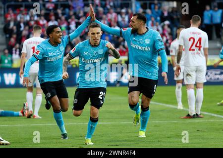 Cologne, Germany. 3rd Mar, 2024. Alejandro Grimaldo (C) of Bayer 04 Leverkusen celebrates scoring with teammates during the first division of Bundesliga match between FC Cologne and Bayer 04 Leverkusen in Cologne, Germany, March 3, 2024. Credit: Joachim Bywaletz/Xinhua/Alamy Live News Stock Photo