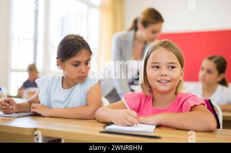 Kid cheating during test Stock Photo