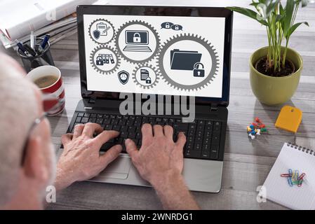 Confidential data concept shown on a laptop used by a man Stock Photo