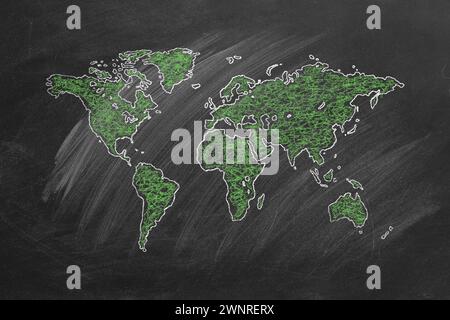 World map hand drawn in chalk. Sketch on a blackboard. Stock Photo