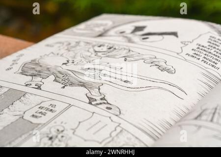 August 31, 2023, Close-up of an open comic book with bokeh background. Wadaslintang, Wonosobo Stock Photo