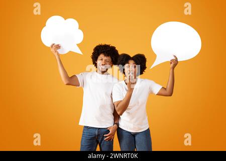 Positive african american man and woman with cloud bubbles Stock Photo