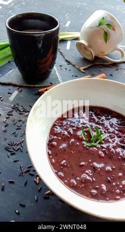 photo of food in the form of black sticky rice with milk Stock Photo