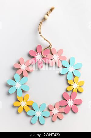 beautiful colorful flower shaped wooden decor on white background, top view Stock Photo