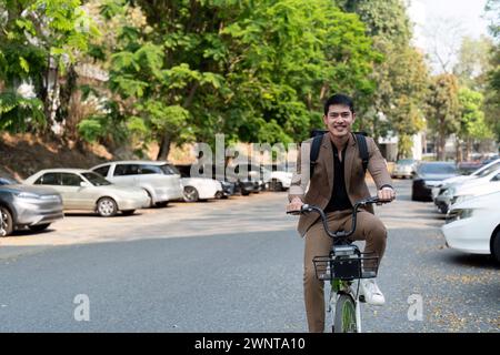 The businessman eco friendly transportation, cycling through the city avenues to go to work. sustainable lifestyle concept Stock Photo