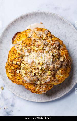 Spicy baked cauliflower with tahini dressing and pistachios. Vegan ...