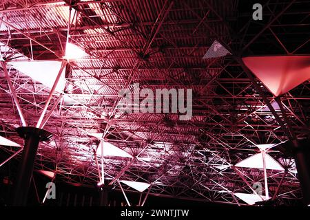 Metal structures under the ceiling. Decorative details of the airport ceiling . Concrete beams, glass windows and metal elements as public building Stock Photo