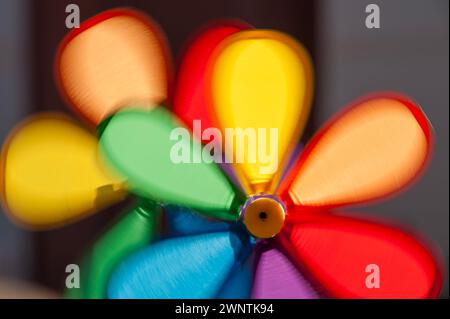 Colorful pinwheels in motion, moved by the wind Stock Photo