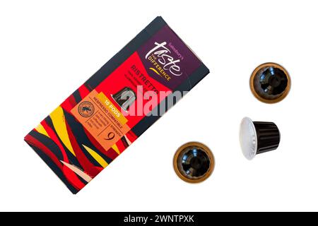 Box of Sainsburys taste the difference Ristretto 100% arabica coffee aluminium capsules with three 3 pods removed isolated on white background Stock Photo