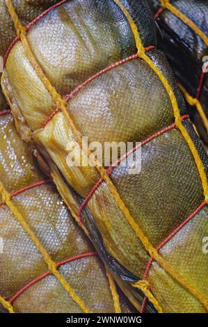 Hot smoked fish on a market counter, close-up shot, abstract food background Stock Photo