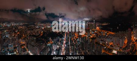 Aerial night view of the Kowloon area in Hong Kong during full moon Stock Photo