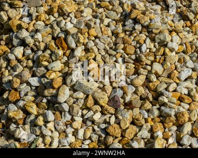 Yellow gravel stone, texture background Stock Photo