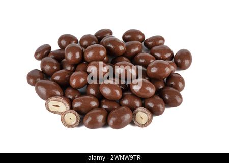 A bunch of dark chocolate peanuts isolated on a white background. Close up. Stock Photo