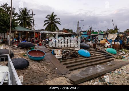 The dirty beach of the fishing harbor of Hoi An in Vietnam Stock Photo