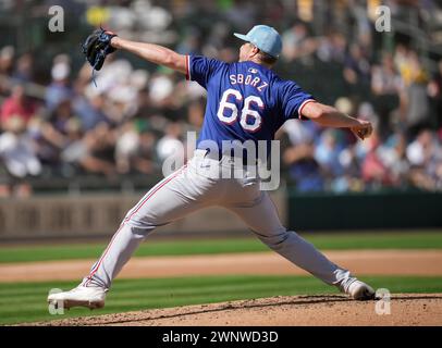 Texas Rangers relief pitcher Josh Sborz (66) pitches during MLB spring training Baseball game, Sunday, Mar. 3, 2024, in Mesa, Ariz. Oakland A beat Texas 5-2 (David Venezia/Image of Sport) Stock Photo