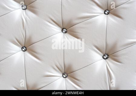 Bright upholstered sofa. Leather Sofa Texture , Gray Leathers Upholstery Pattern. Light background furniture upholstery Stock Photo
