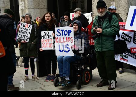 Caxton House, London, UK. 4th Mar, 2024. Disabled People Against Cuts (DPAC) protested against the Department for Work and Pensions (DWP) over so-called 'welfare reforms' that attack vulnerable people. Over the years, there have been more than 100,000 deaths due to benefit cuts, lack of access to health care, denied benefits, and energy crises. Disabled people with wheelchairs are blocking the road in front of Westminster Abbey in London. Credit: See Li/Picture Capital/Alamy Live News Stock Photo