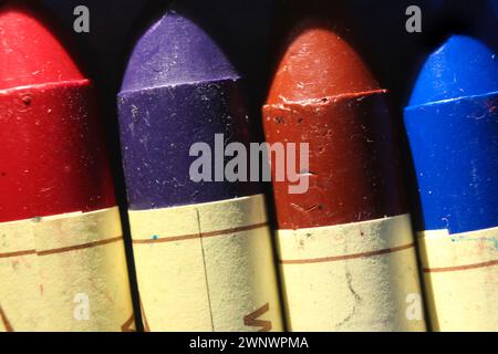 Stacked pile of vintage colour crayons, macro view Stock Photo