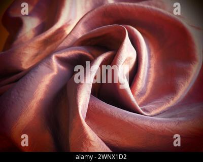 Beautiful fabric - taffeta, gently folded in waves. Crumpled material that looks like silk or brocade. Overflow and color gradient at different Stock Photo