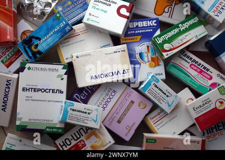 KYIV, UKRAINE - NOVEMBER 27, 2023 Many boxes of pills and capsules stacked in pharmacy drug store close up Stock Photo
