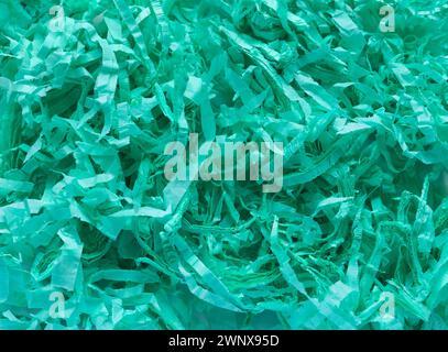 Green shredded paper. Backgrounds and textures. Stock Photo