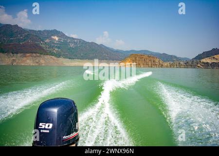 Tehri Lake, water surface behind of fast moving motor boat in Tehri ...