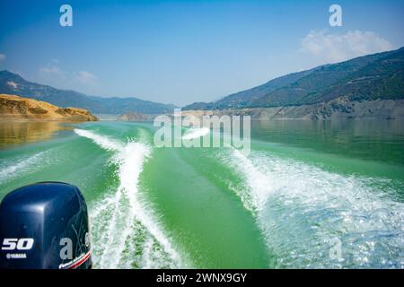 Tehri Lake, water surface behind of fast moving motor boat in Tehri ...
