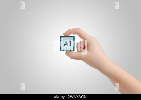 Hand holding AI chip. Symbolizing advancements in ai technology and machine learning development Stock Photo
