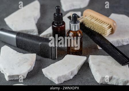 Directly above shot of various barber tools arranged on stone table in shop Stock Photo